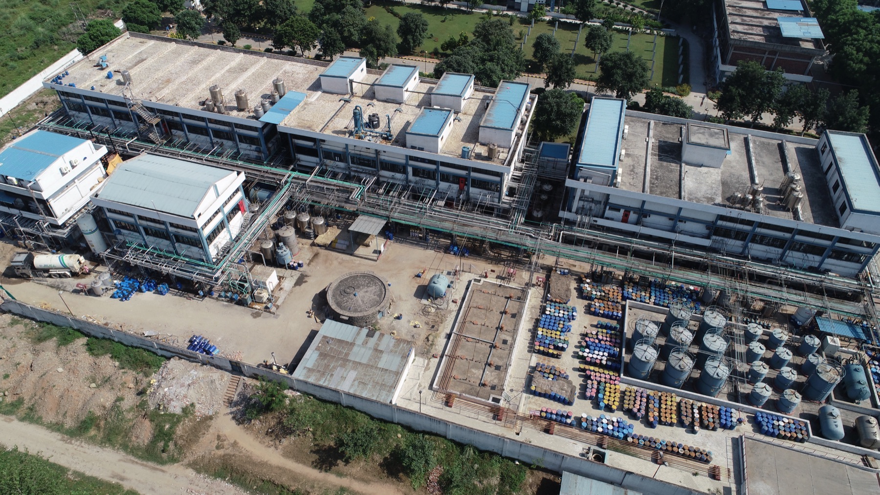 Aerial view of a Morepen API manufacturing facility with production blocks, pipe racks and tank farm